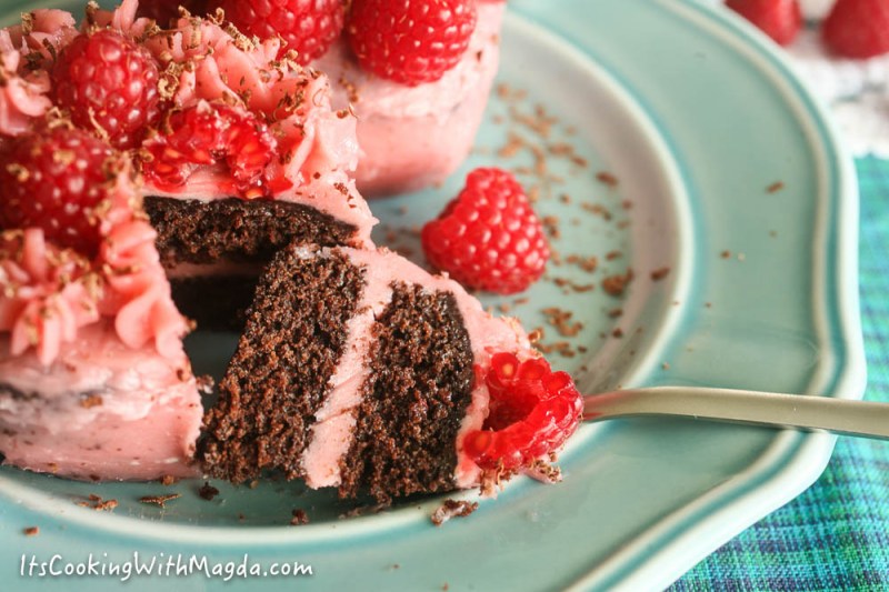 heart shaped chocolate cupcake with raspberry frosting in the middle