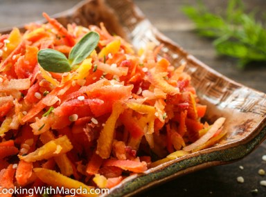 Grated carrots and apple salad on a square plate