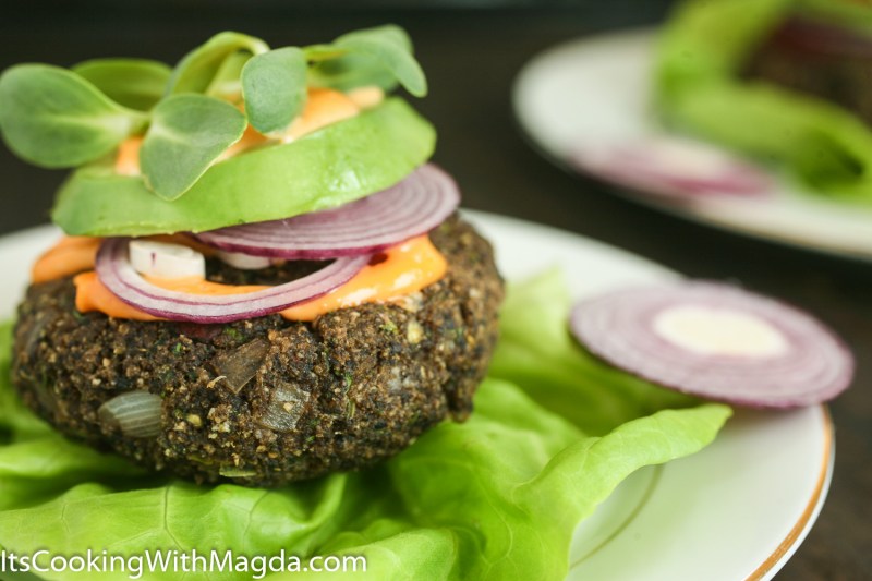 mushroom jalapeno burger with sriracha, avocado, red onion on a lettuce leaf