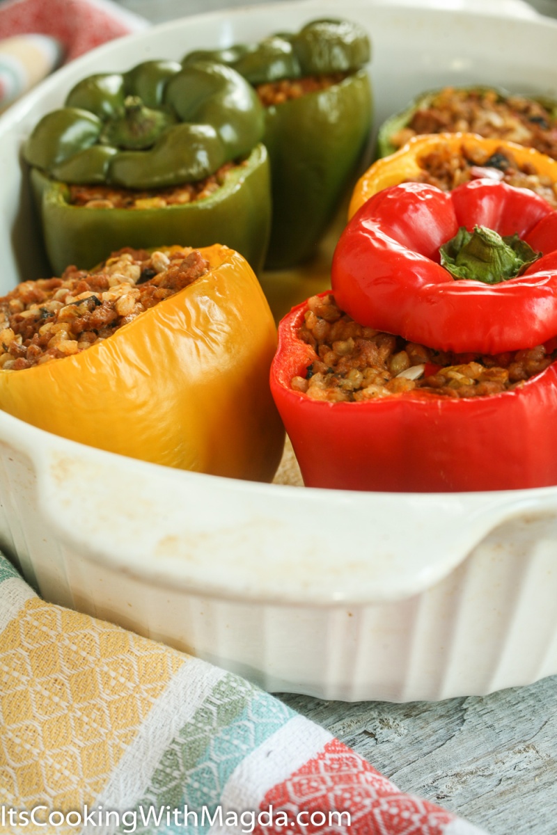 cooked bell peppers stuffed with meat, rice, vegetables