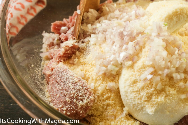 ground turkey, ricotta cheese, parmesan cheese, chopped shallot in a bowl
