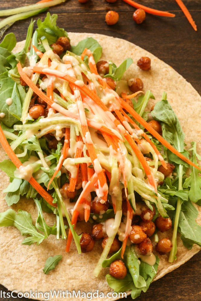 whole wheat wrap with spiced chickpeas, vegetables and tahini dressing