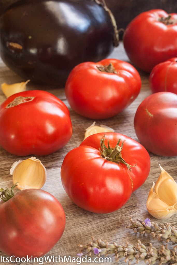 a display of tomatoes and eggplant