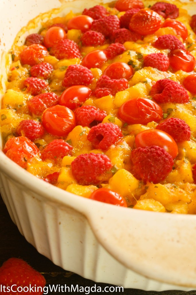 salmon roasted with mango pineapple salsa, raspberries and tomatoes