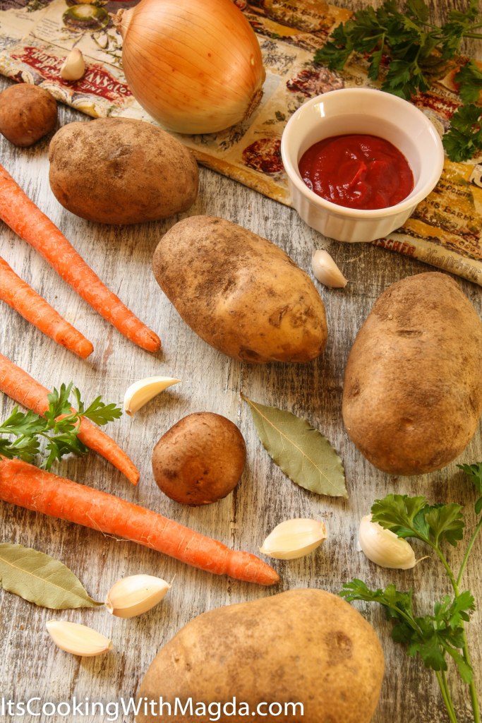 display of potatoes, carrots, garlic and spices