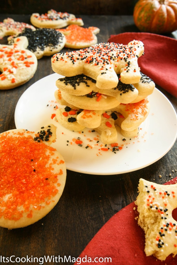 A stack of Halloween cookies decorated with sprinkles