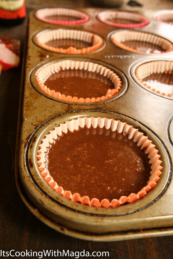 cupcake pan filled with chocolate batter