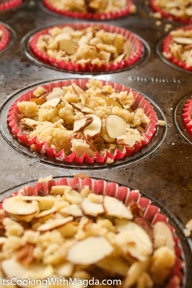 cranberry orange muffins with almond topping before baking