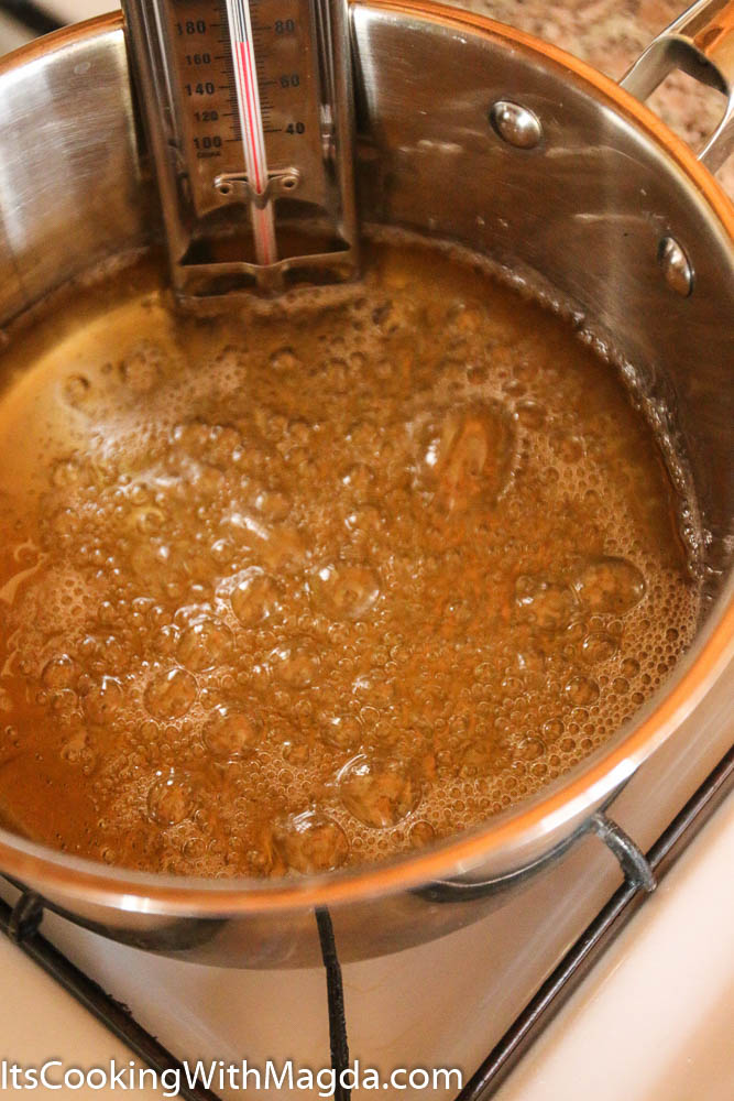 sugar and corn syrup mixture boiling in a pot