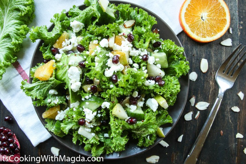 Mustard greens salad with pear, pomegranate and goat cheese