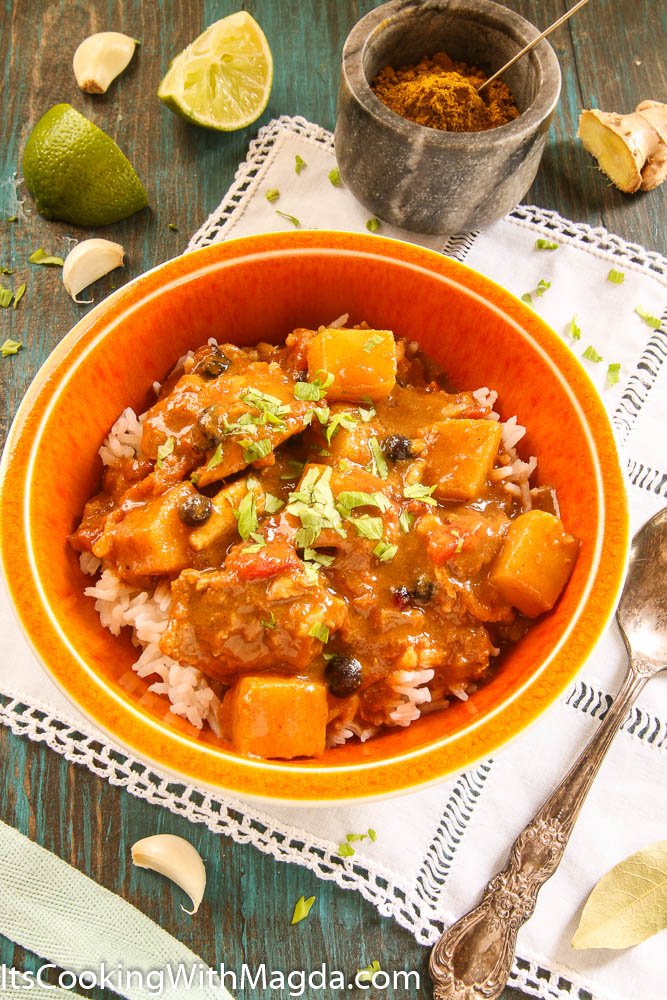 a bowl of rice and chicken curry with pineapple
