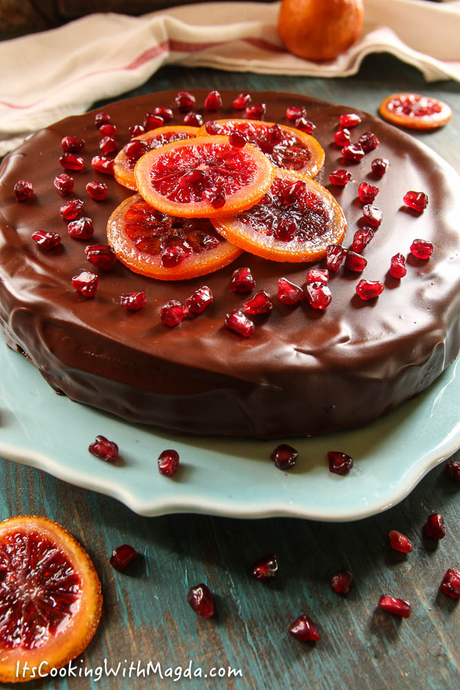 buckwheat chocolate cake decorated with candied oranges and pomegranates
