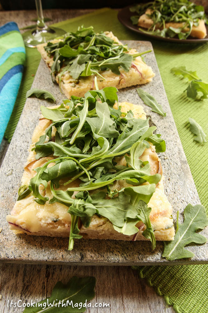 white pizza with arugula, pear and jalapeno