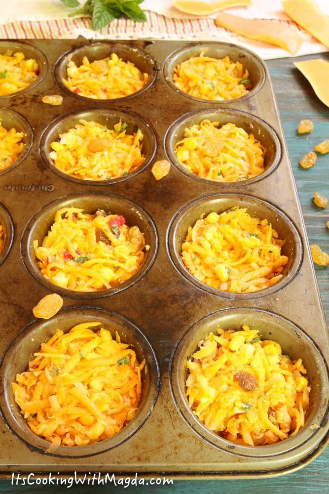 butternut squash cakes in a muffin pan