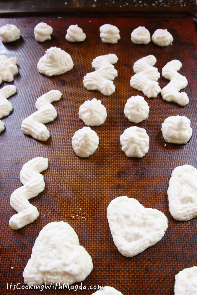 coconut meringues on a baking sheet