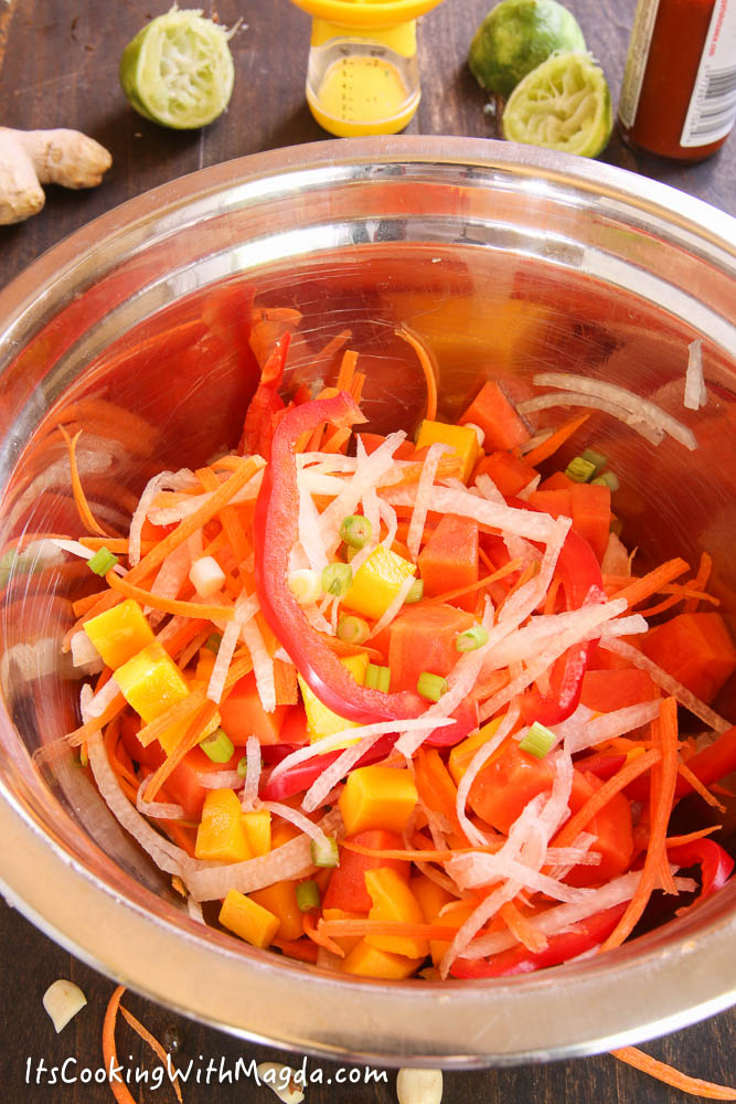 chopped mango, papaya, carrots, bell pepper and jicama in a bowl