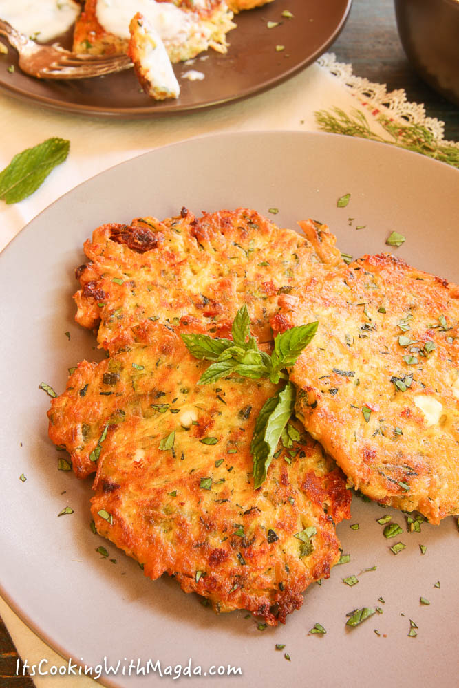 zucchini fritters with feta cheese, jalapeno and herbs
