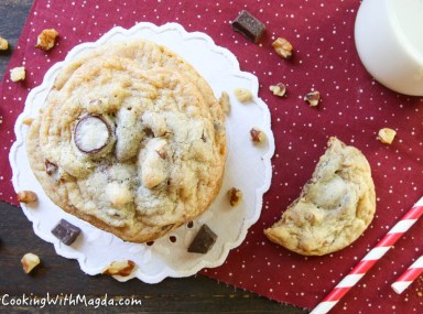 display of chocolate chip cookies with a glass of milk