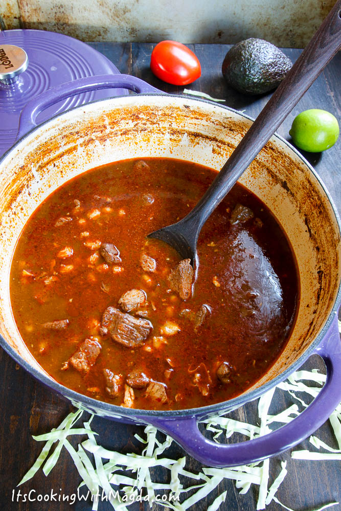 Posole rojo in a purple dutch oven